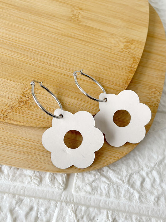 Caravanas de Acero Quirúrgico y Cuero