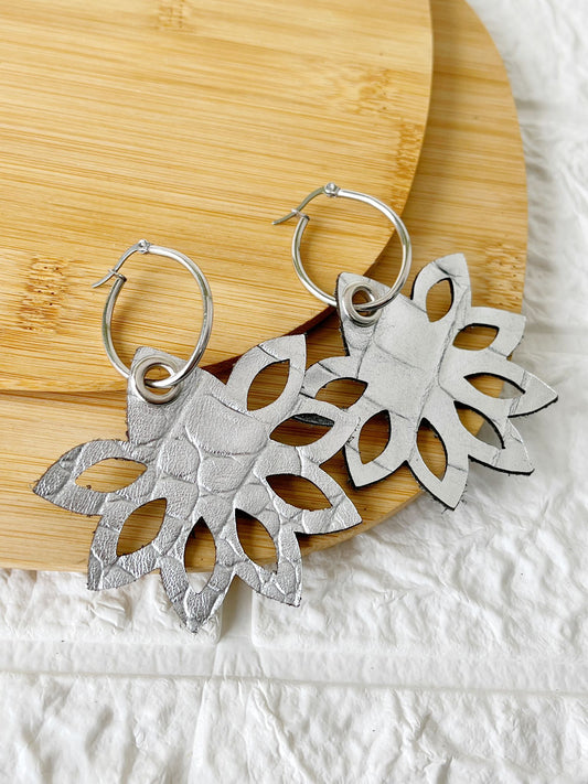 Caravanas de Acero Quirúrgico y Cuero